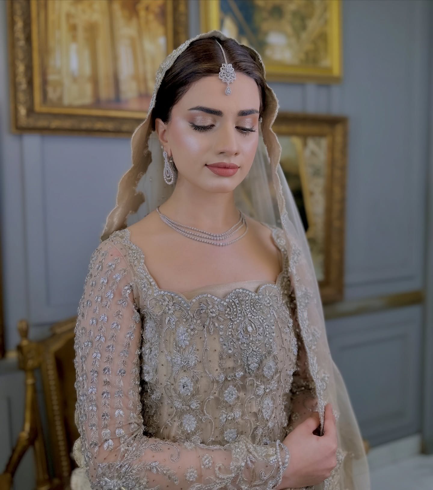 NUMRA bridal makeup — soft glam bridal look with a champagne dupatta and layered necklace